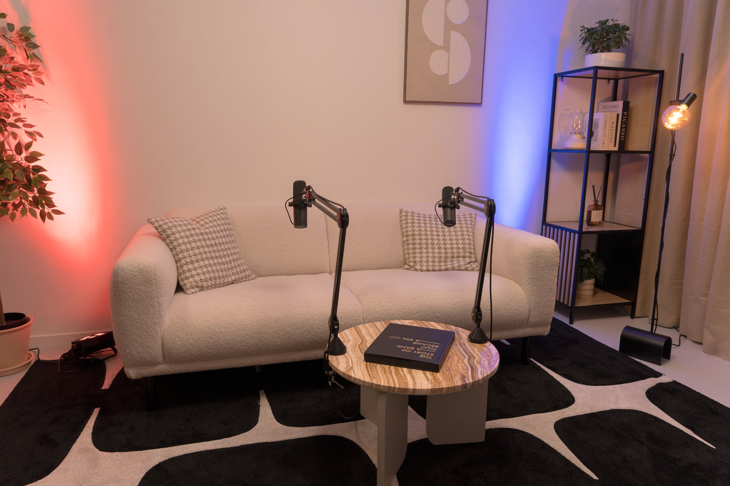 Amsterdam podcast studio with a couch and micraphones close-up