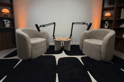 Professional Podcast studio in Living room style with two armchairs, lights and two microphones