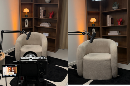 Podcast studio with beige armchair in a room with bookshelves and a lamp.