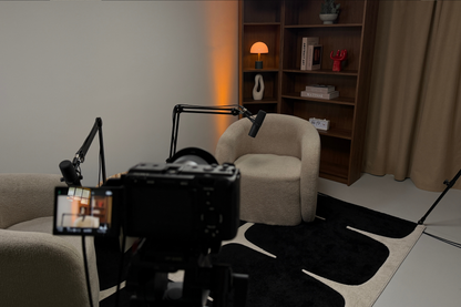 Sony FX30 in a professional podcast studio with two armchairs, lights and microphone